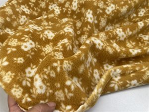 Fleece - okker med fine offwhite blomster